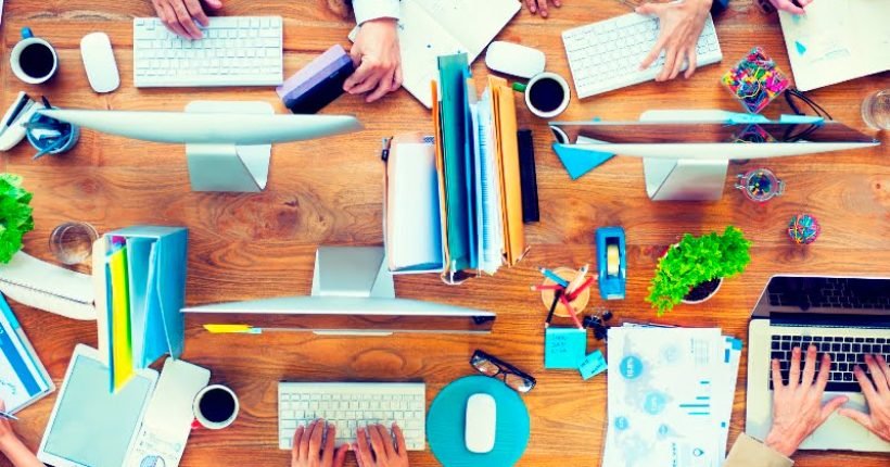 Group of Business People Working on an Office Desk